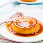 Venezuelan Quesillo with caramel sauce on a plate with a spoon