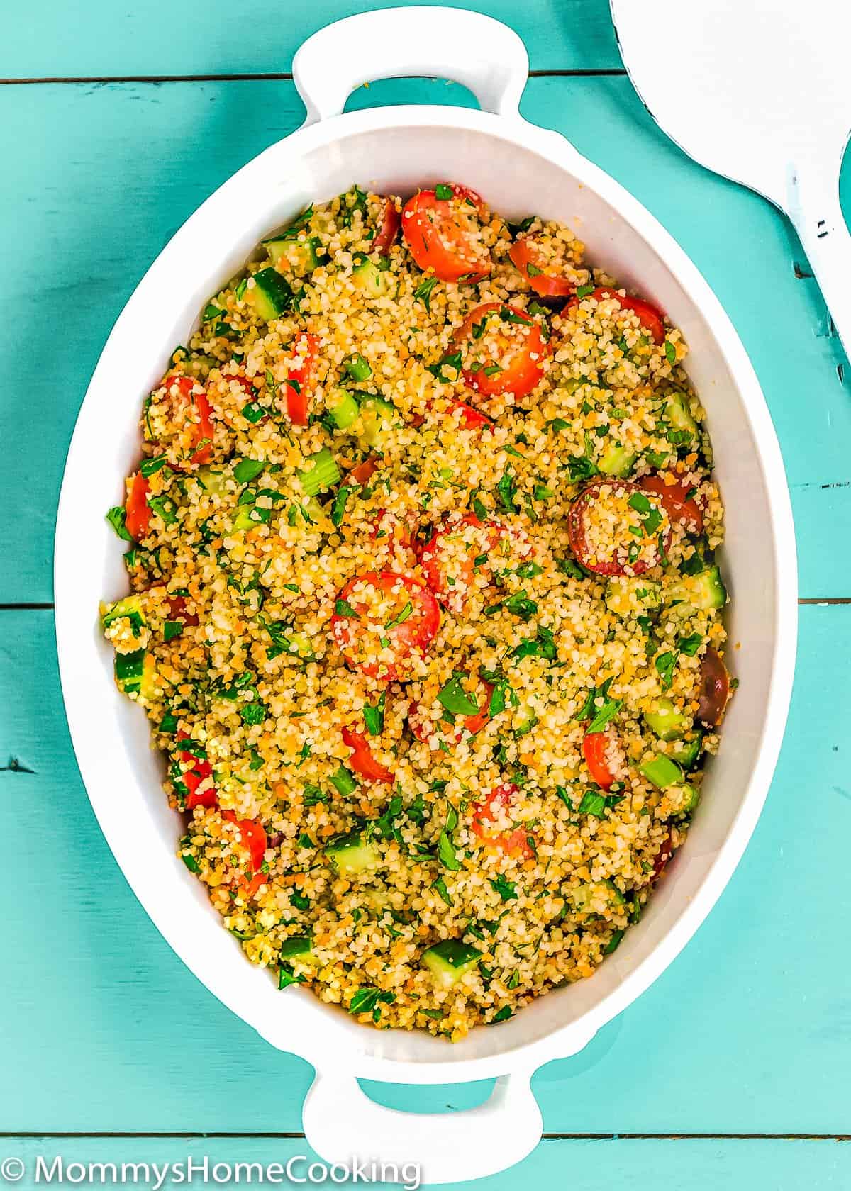 a white serving plate with Couscous Tabbouleh Salad.