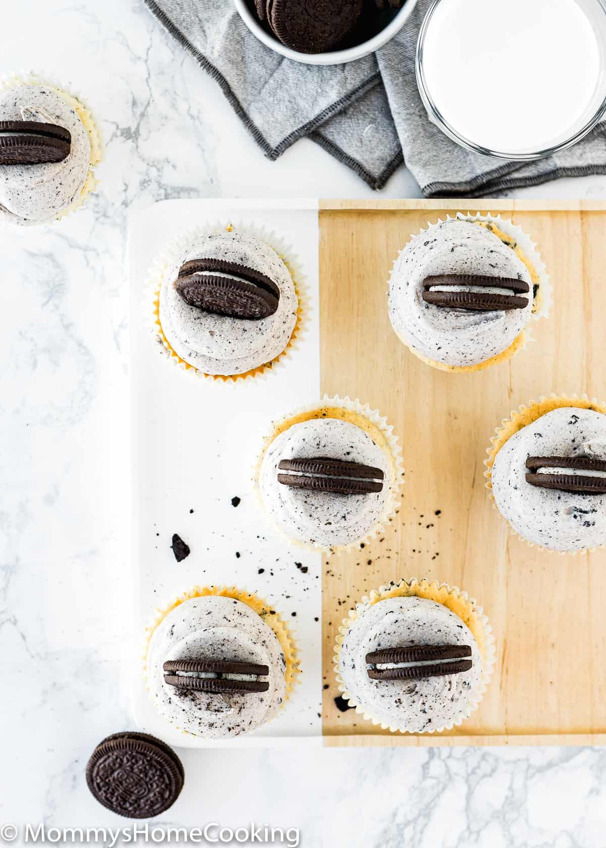 overhead view of egg free Oreo cupcakes over a marble surface.
