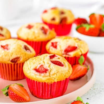 egg-free strawberry muffins on a pink plate.