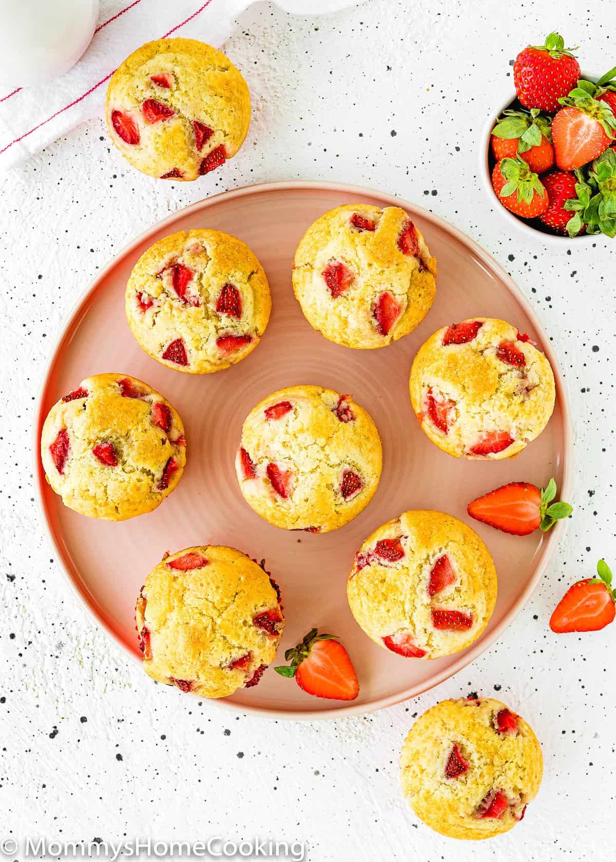 overhead view of a plate with eggless strawberry muffins.