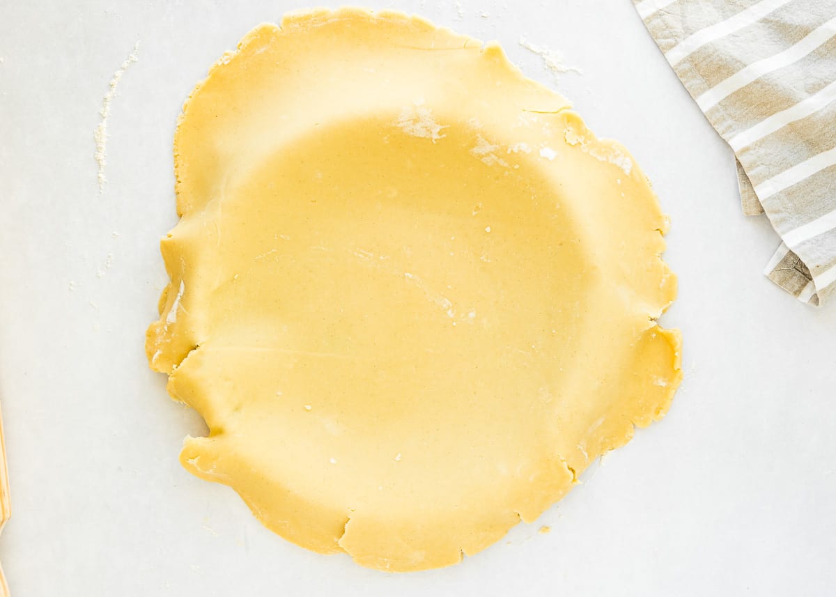 a tart pan covered with an eggless tart dough. 