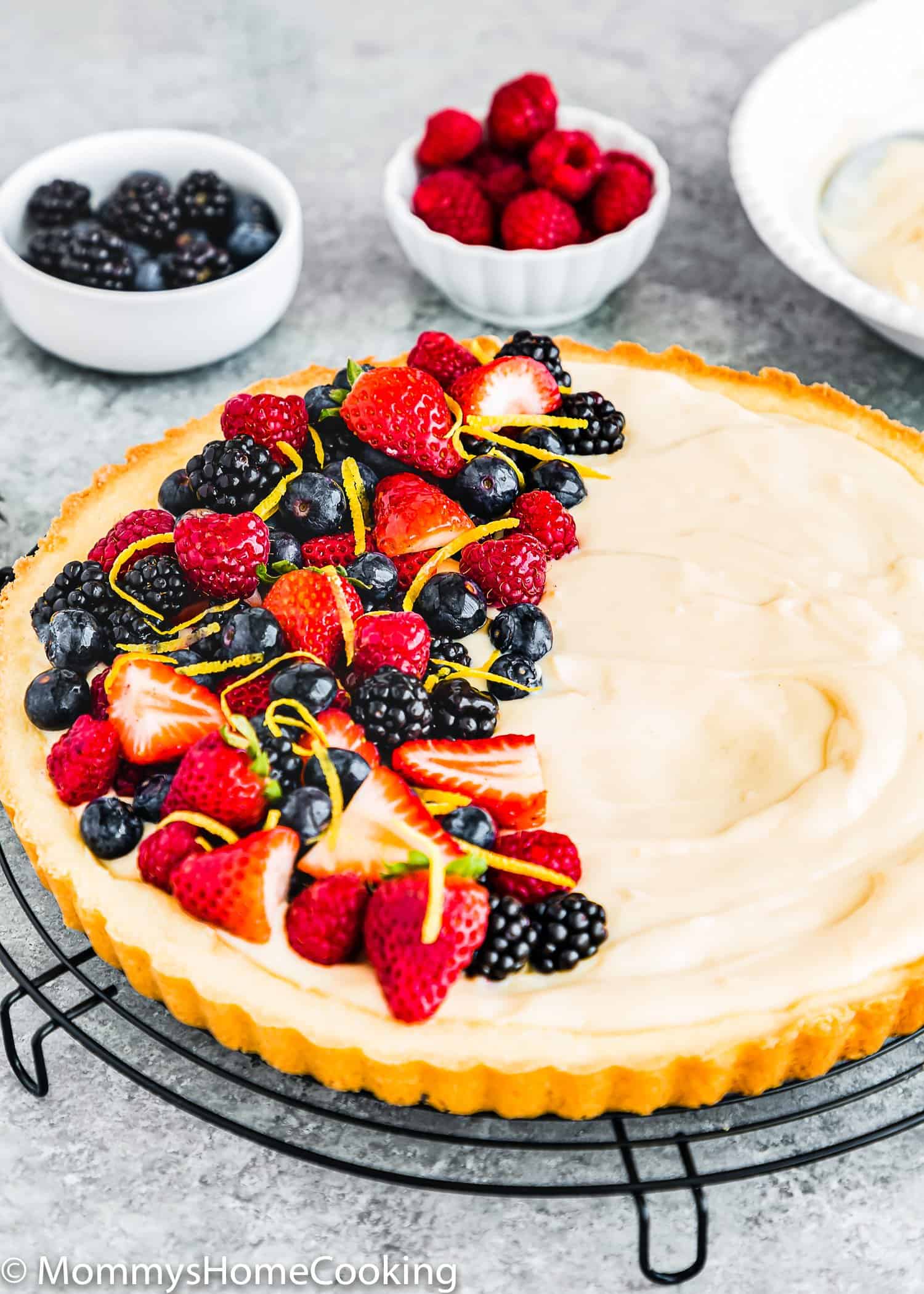 whole Eggless Fruit Tart filled with eggless pastry cream and fresh berries.