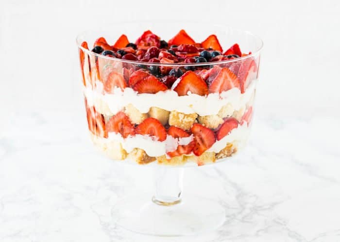 five layers of egg-free trifle in a trifle dish. 