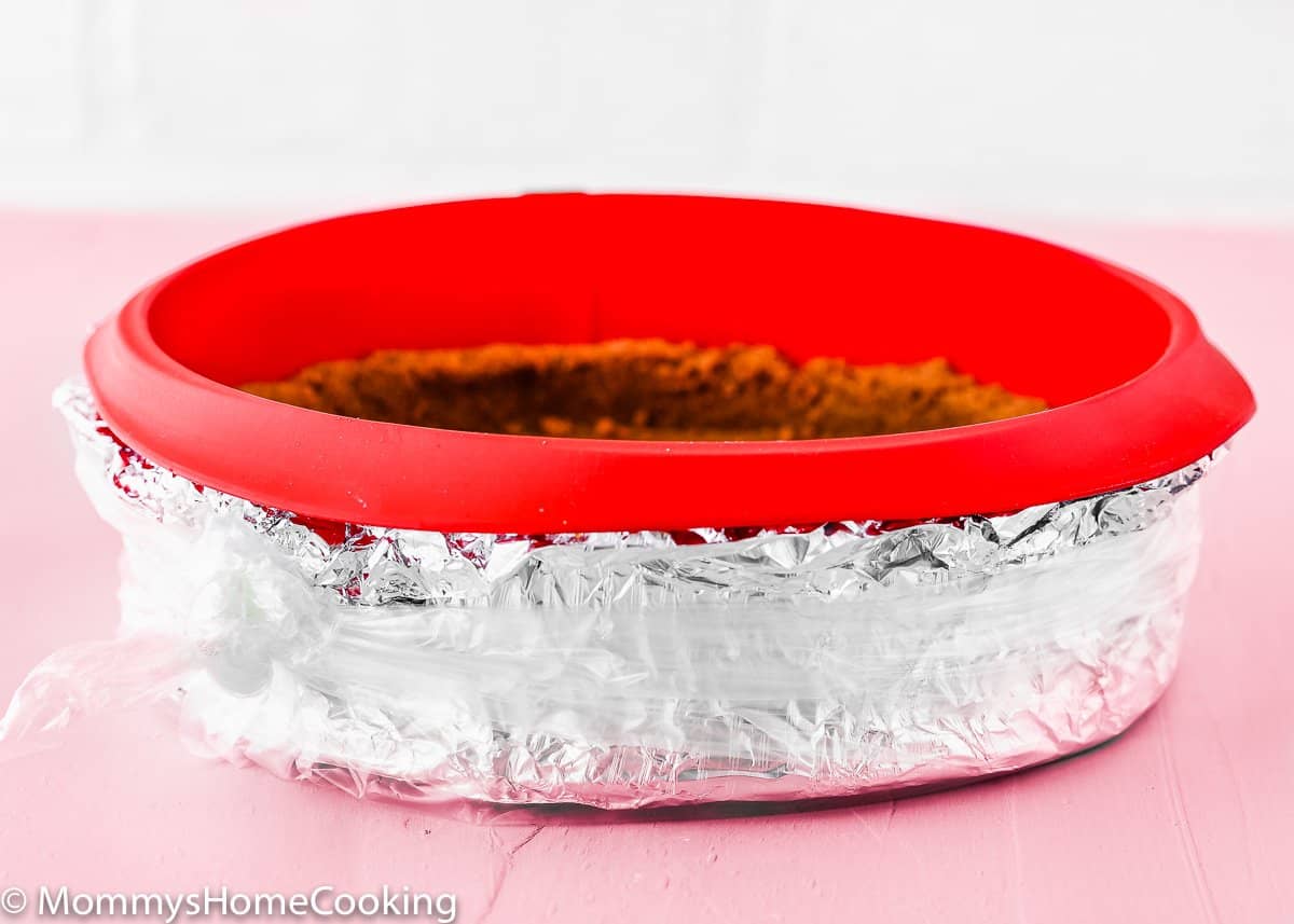 springform pan wrapped with foil to make eggless cheesecake