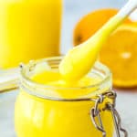 Easy Eggless Lemon Curd in a glass jar with a spoon