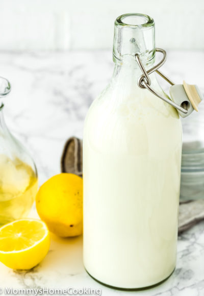homemade buttermilk in a bottle with lemons in the background