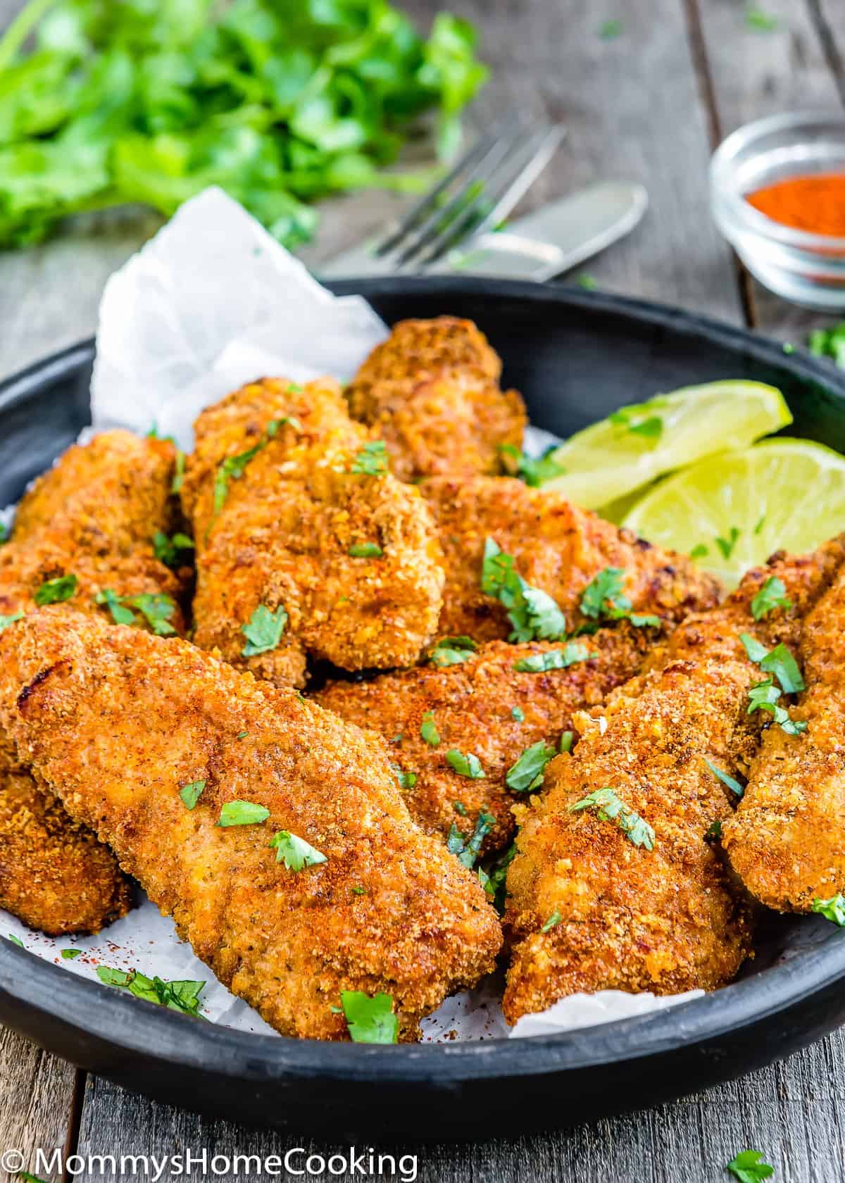 Eggless Oven Fried Chicken Tenders garnished with chopped cilantro
