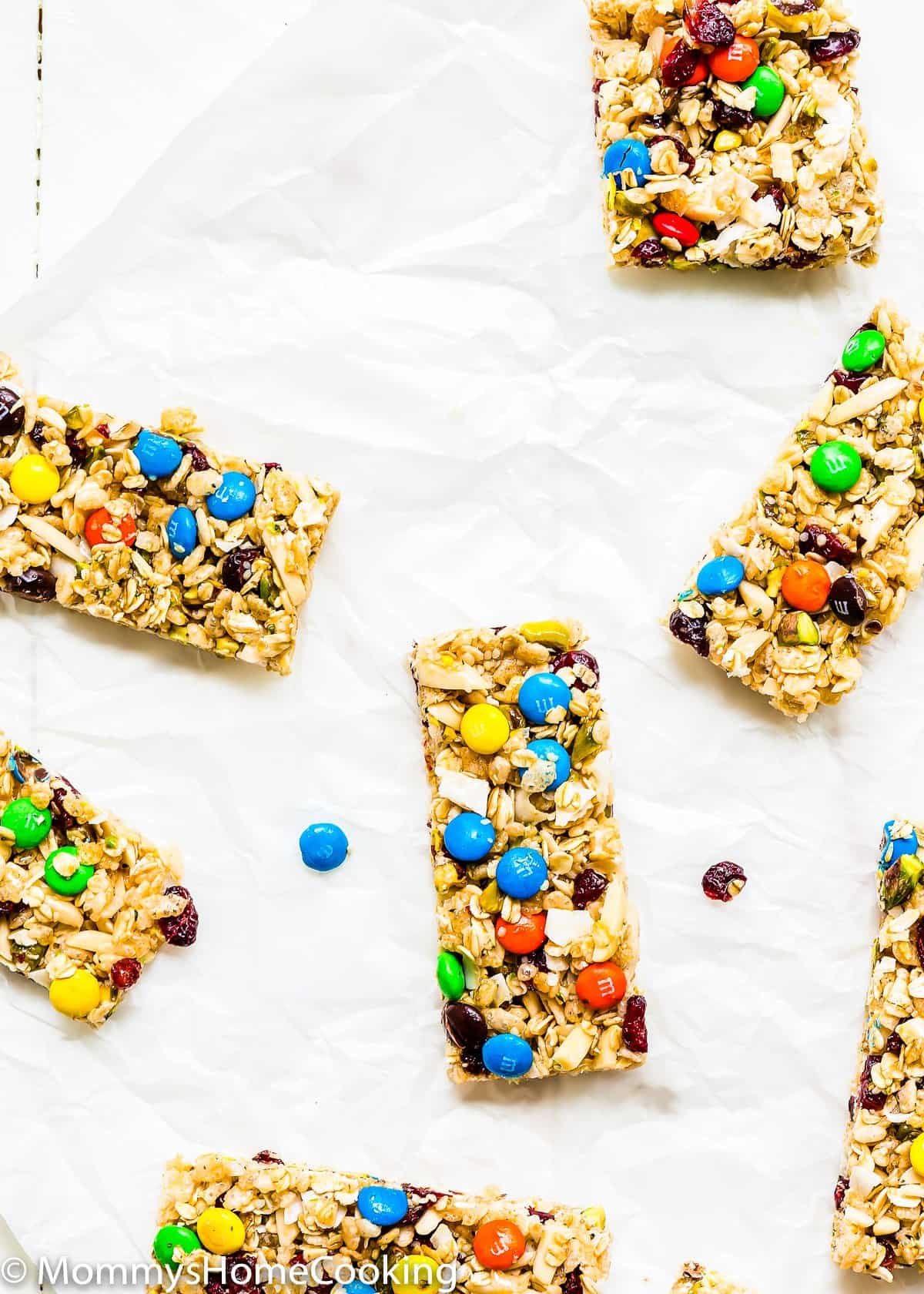 Multiple no bake protein bars on a parchment paper.