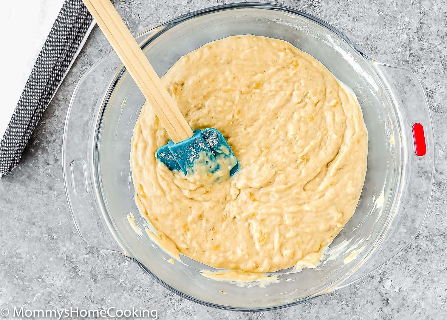 egg-free banana muffin batter in a bowl with a spatula. 