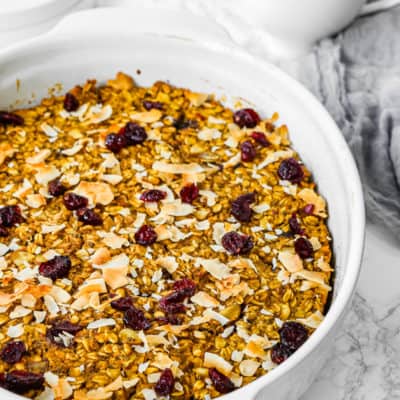 Eggless Pumpkin Baked Oatmeal with cranberries on top