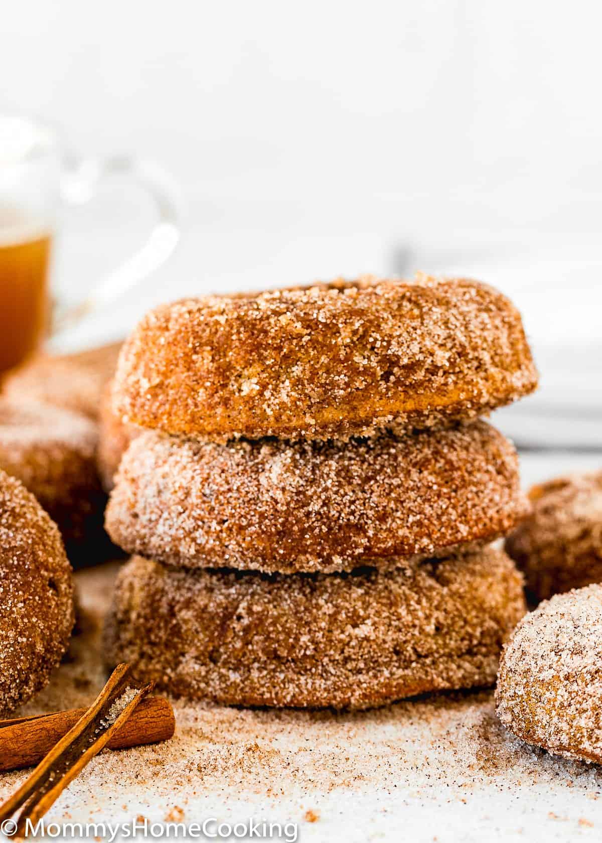 stack of bitten Eggless Apple Cider Donuts