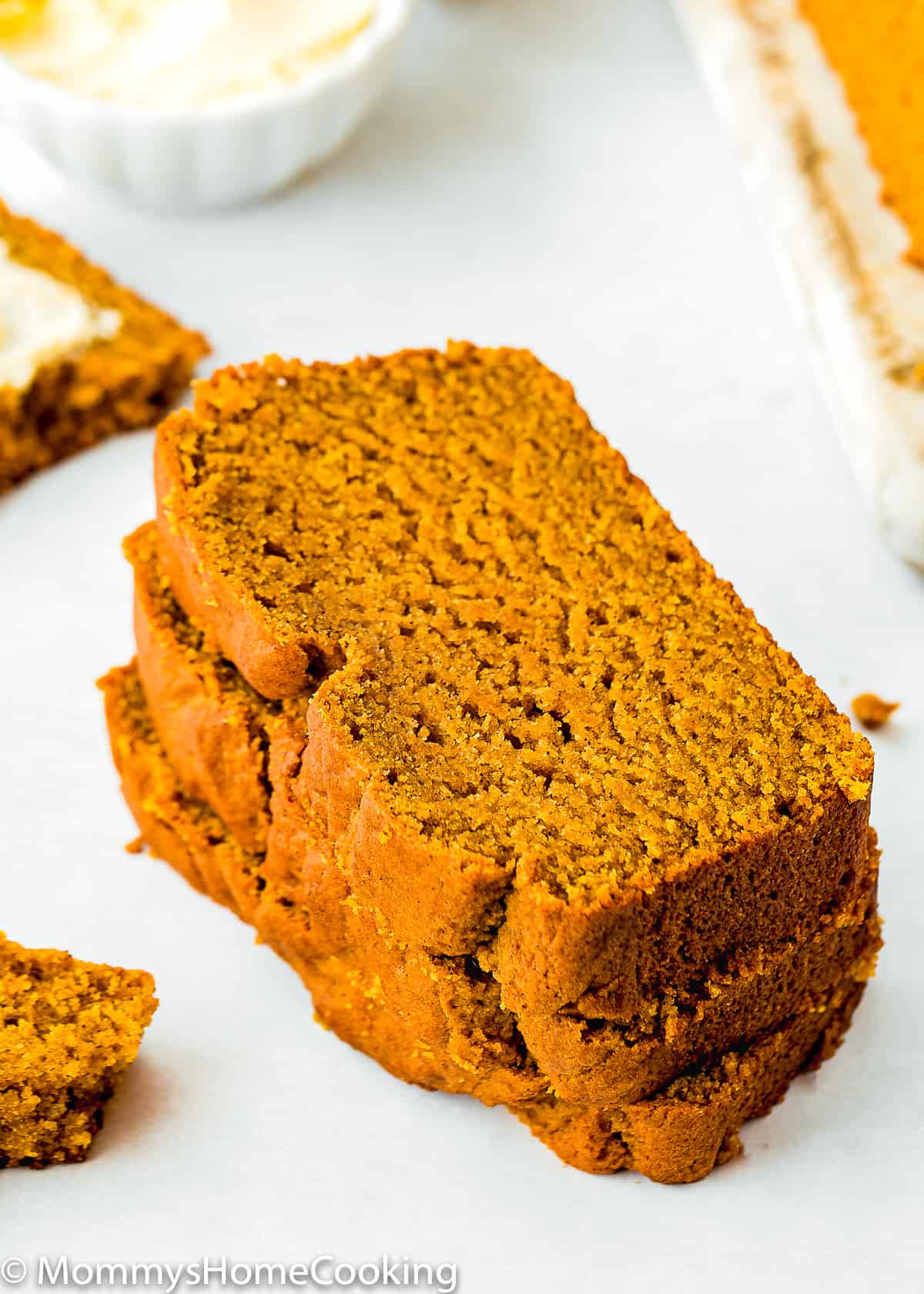 Eggless Pumpkin Bread slices over a white surface