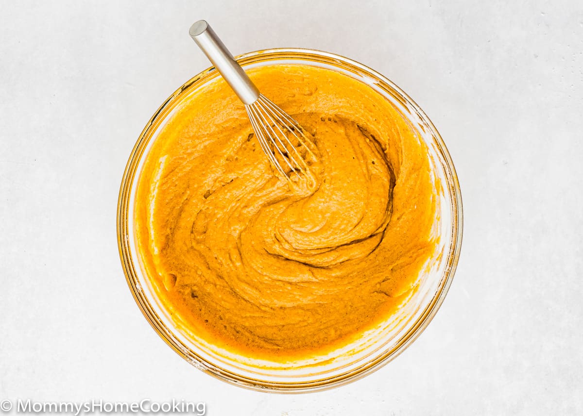 Eggless Pumpkin Bread batter in a bowl with a whisk