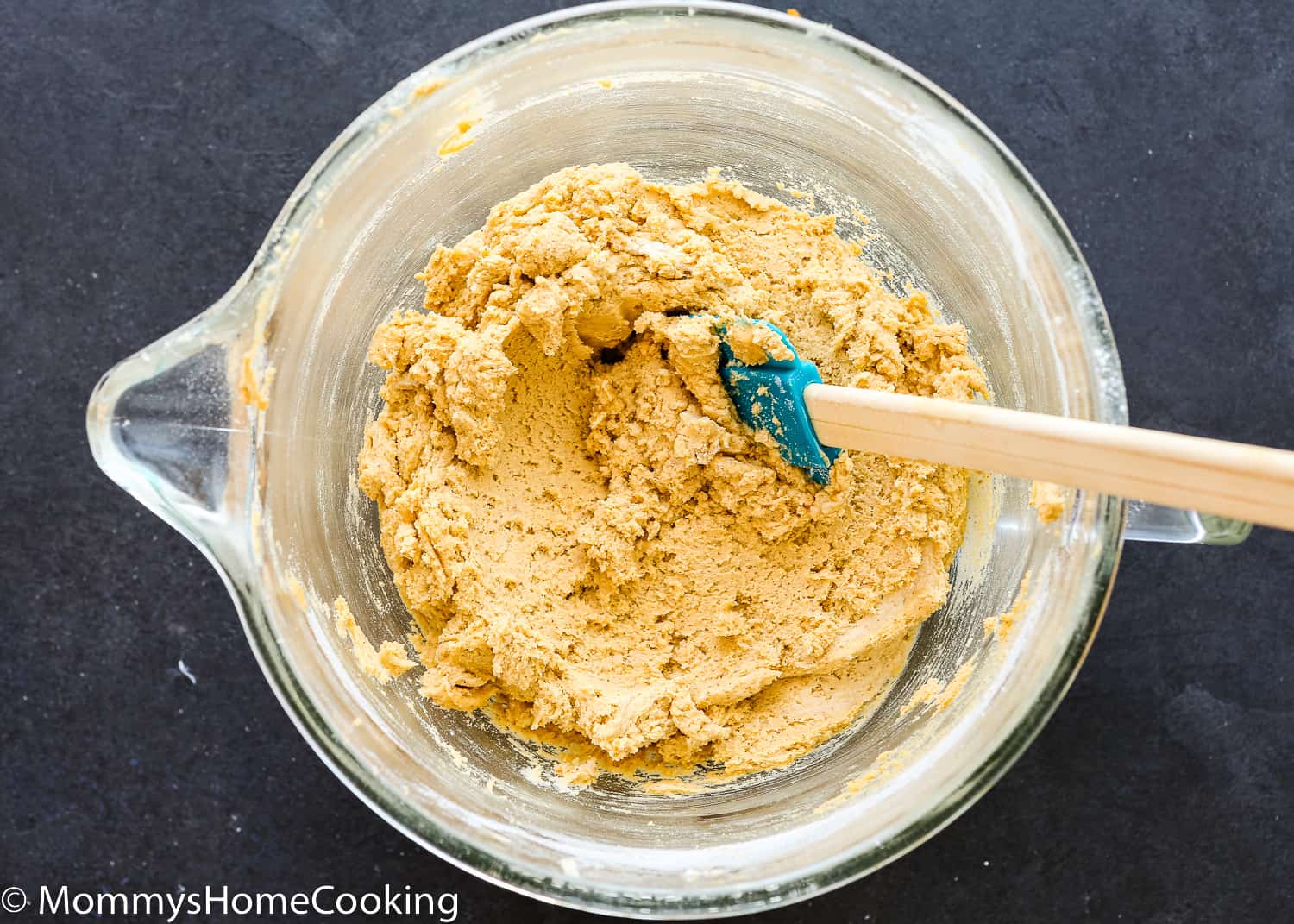 egg-free pumpkin snickerdoodle cookie dough in a stand mixer bowl with a spatula.