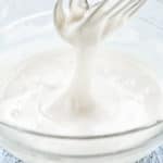 Eggless Royal Icing in a bowl with a whisk