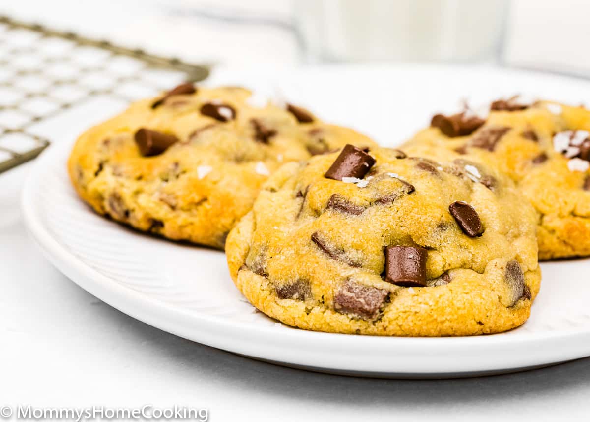 Eggless Chocolate Chip Cookies on a white plate.