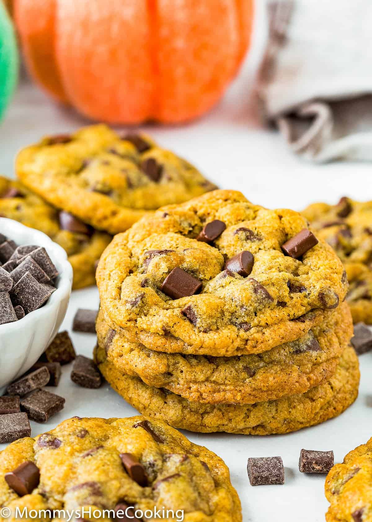 Eggless Pumpkin Chocolate Chip Cookies stack over a white surface