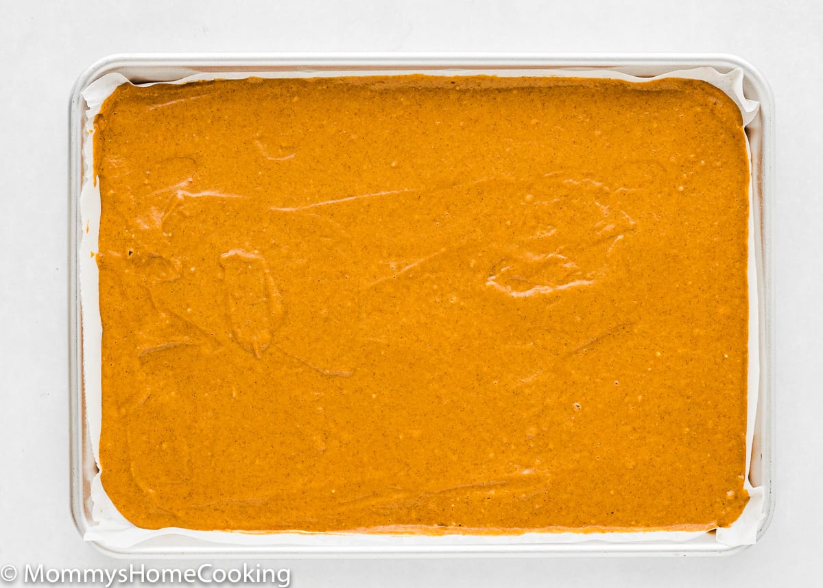 Egg-free Pumpkin Roll batter in a baking tray
