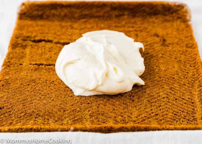 Eggless Pumpkin Roll with cream cheese frosting on top