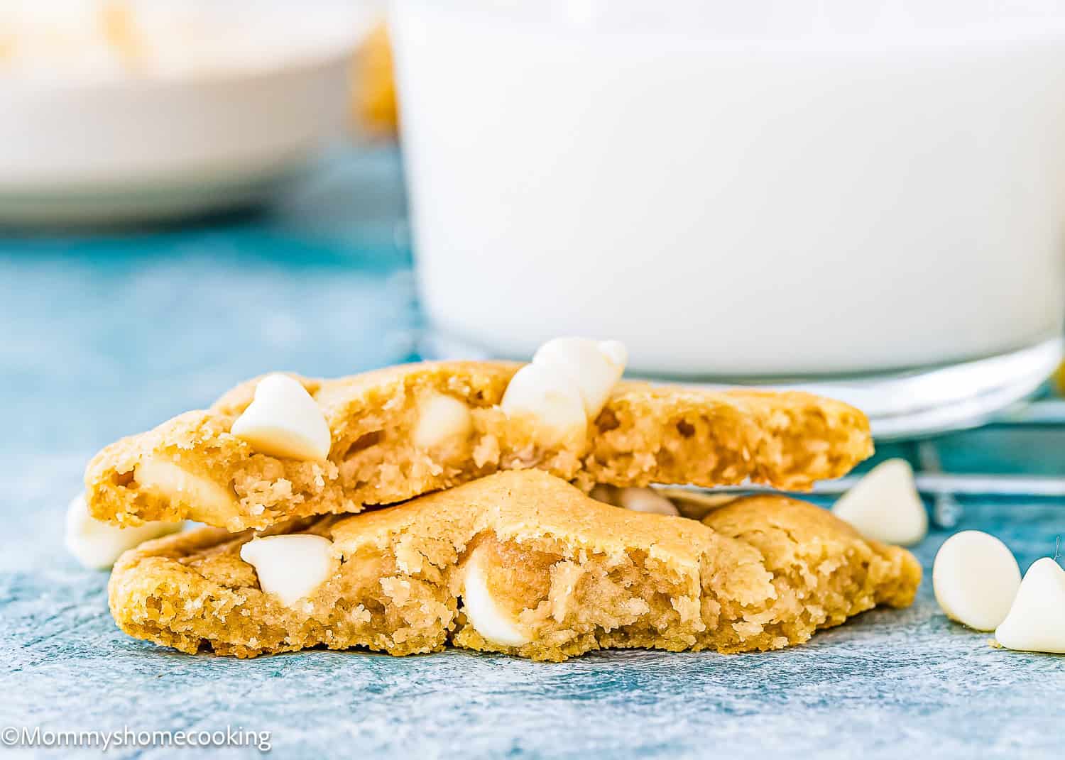 Egg-free White Chocolate Cookie next to a glass of milk.