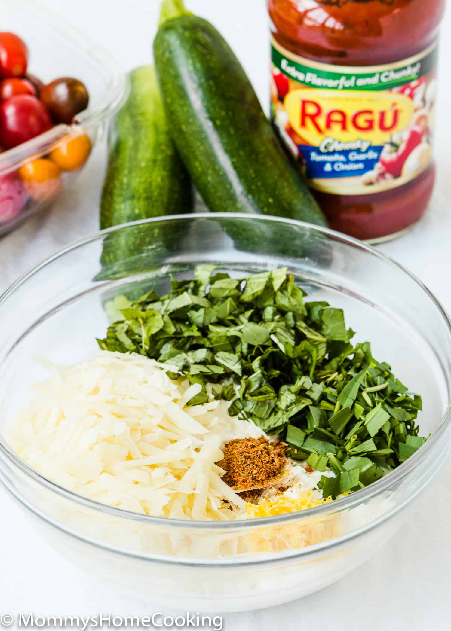 EGGLESS LASAGNA ZUCCHINI ROLLS ingredients over a white surface