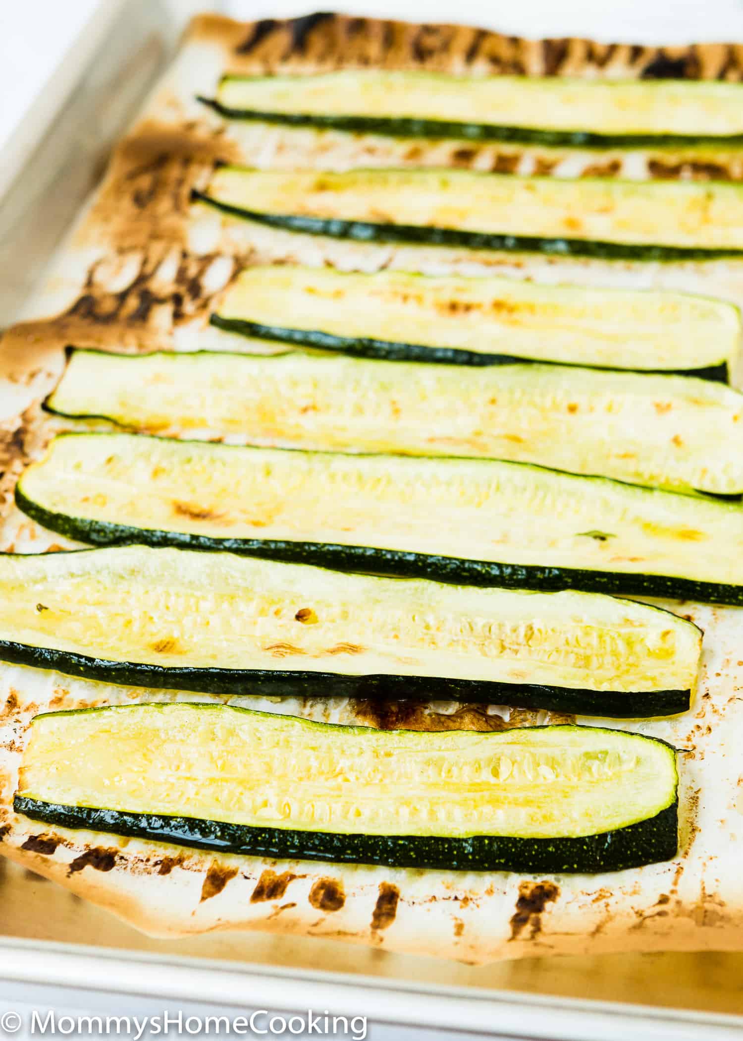 roasted zucchini slices in a baking tray