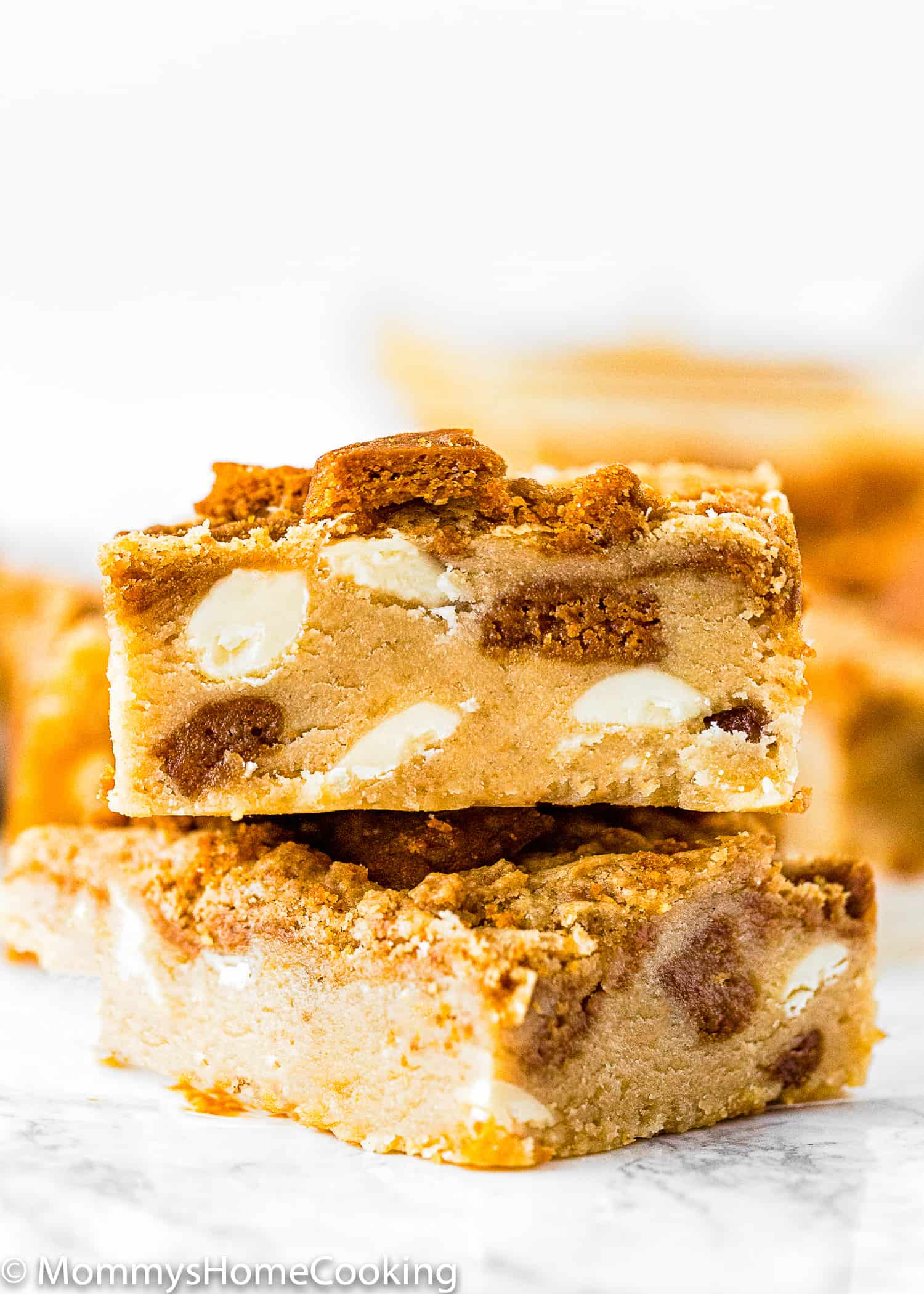 stack of two Eggless Biscoff White Chocolate Blondies.