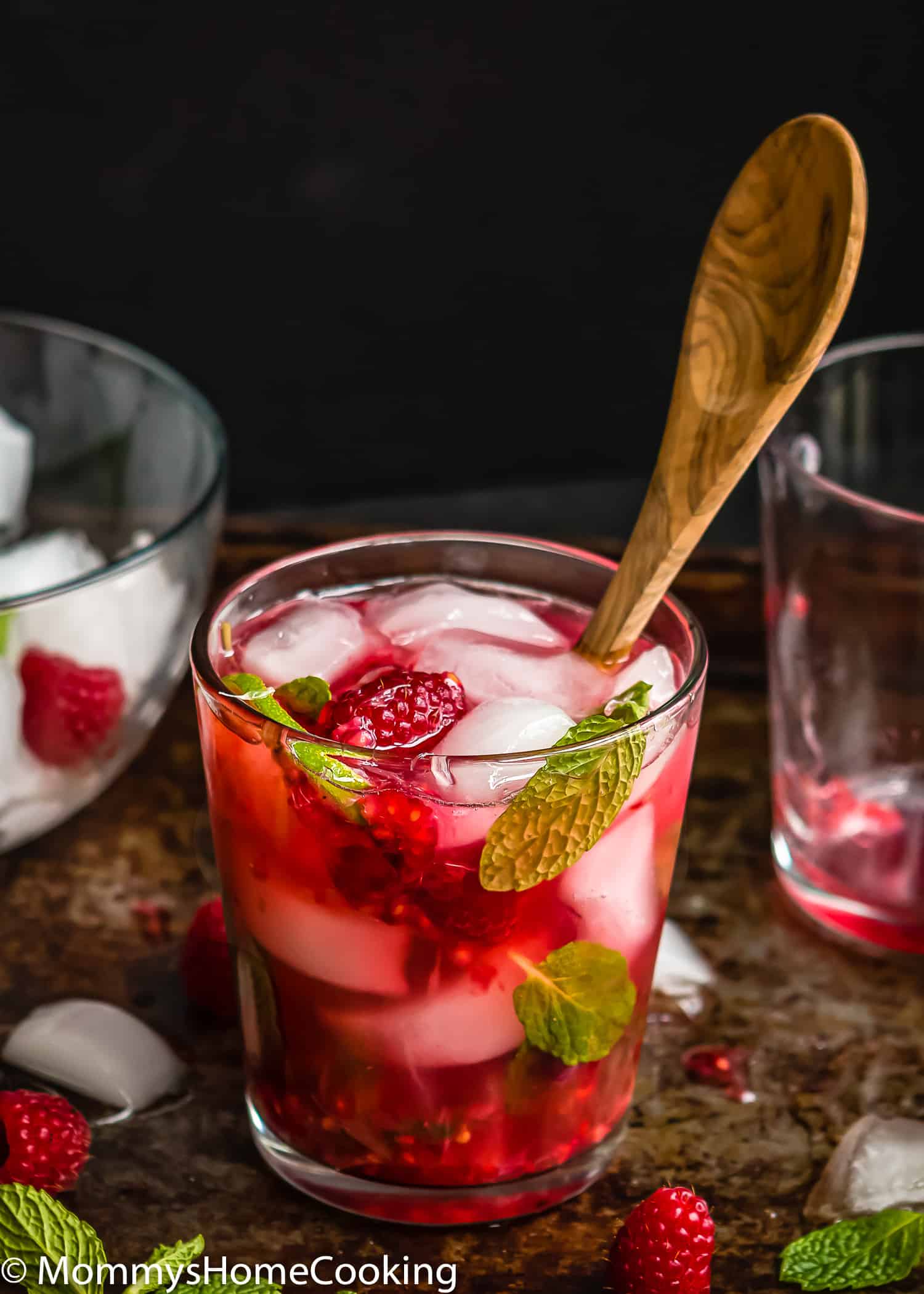 a Raspberry Vodka Mojito in a glass with a spoon on it.