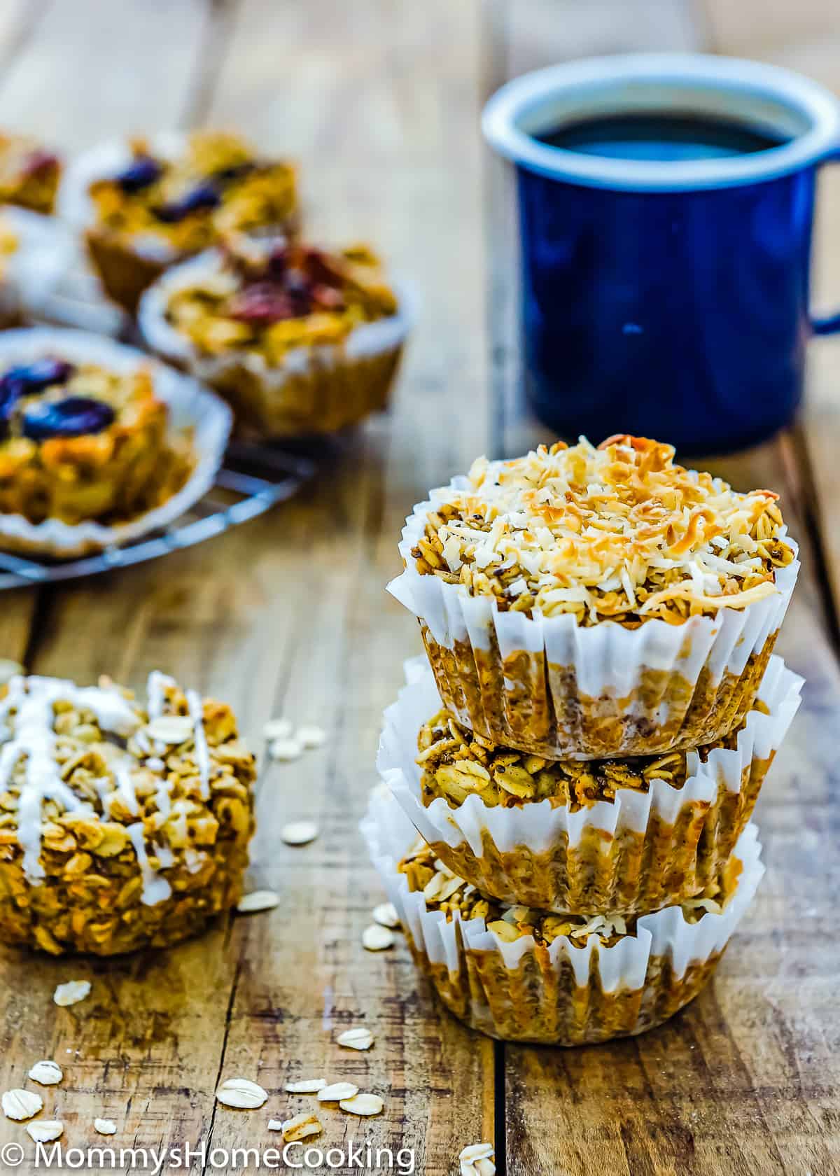 stack of three Eggless Baked Apple Oatmeal Muffins with a cup of coffee on the background.