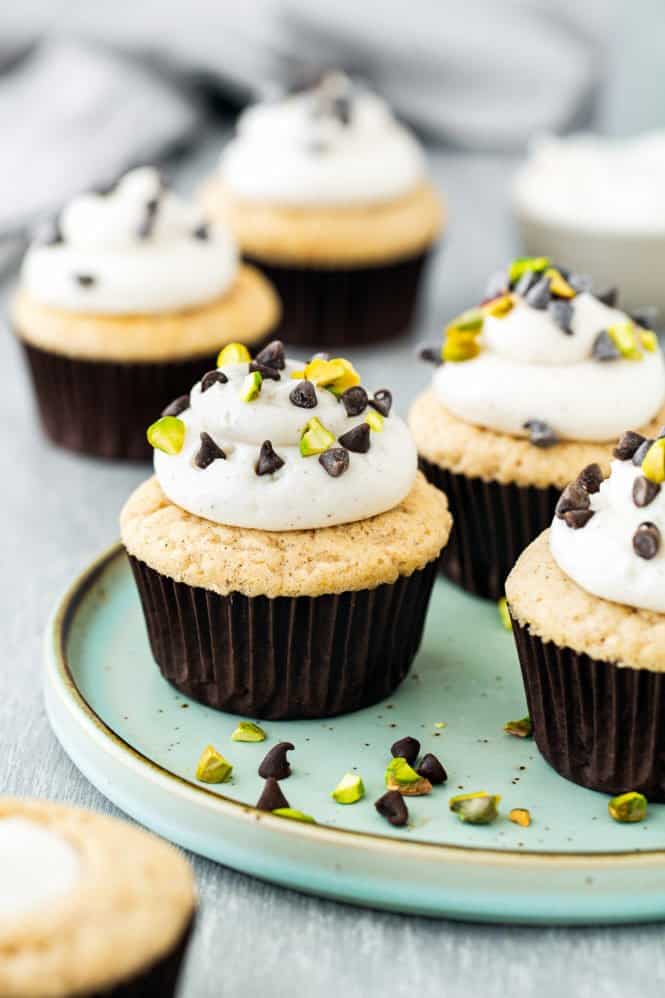 egg-free cannoli cupcakes on a green plate.