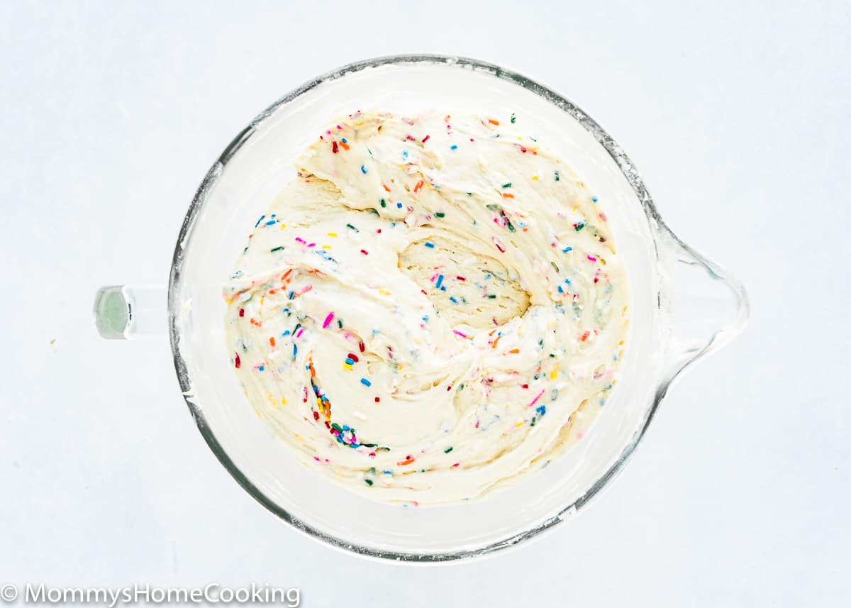 egg-free cake batter with sprinkles in a mixing bowl.