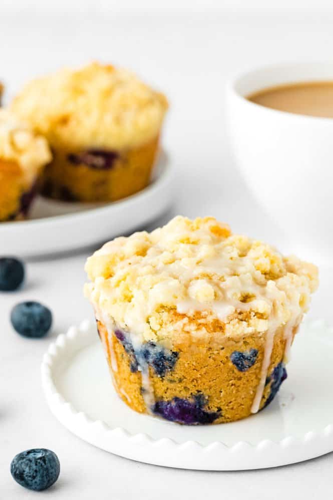 egg-free jumbo streusel blueberry muffins on a plate. 