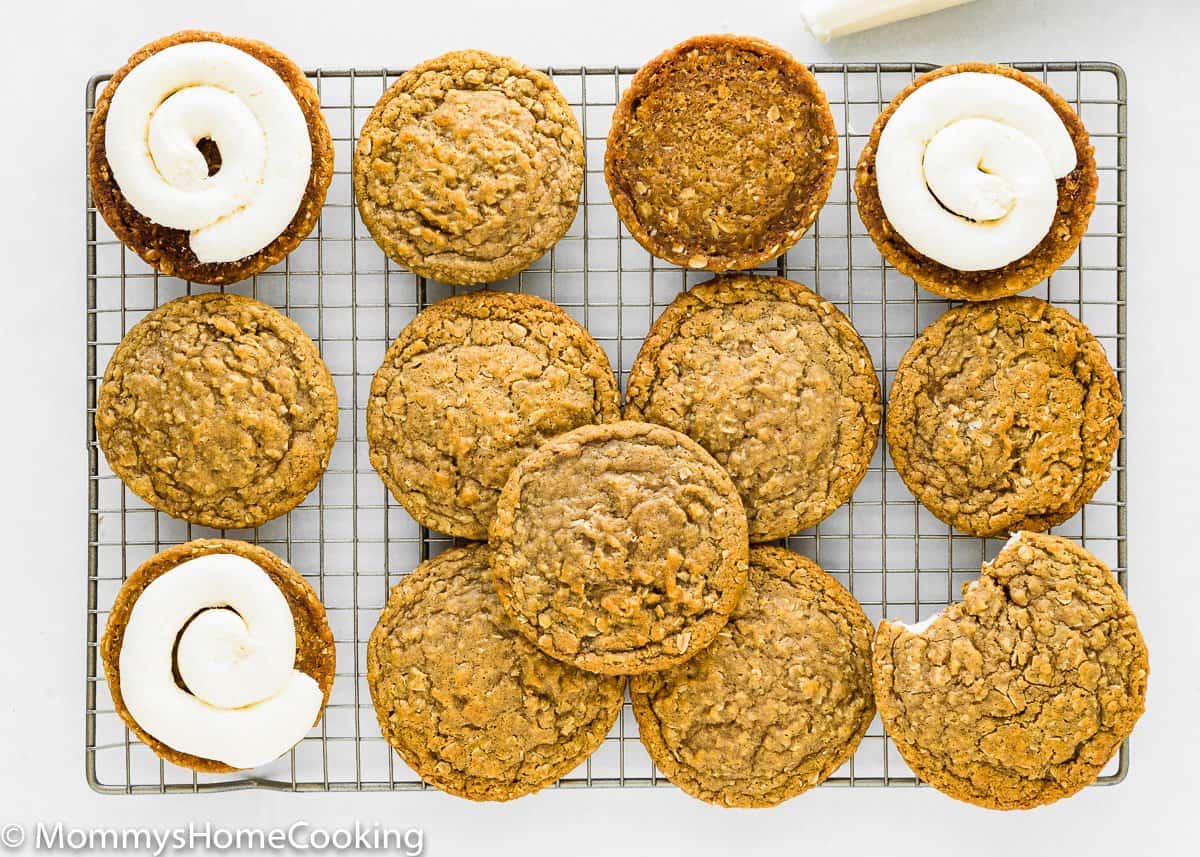 oatmeal cream pies being assemble over a cooling rack.