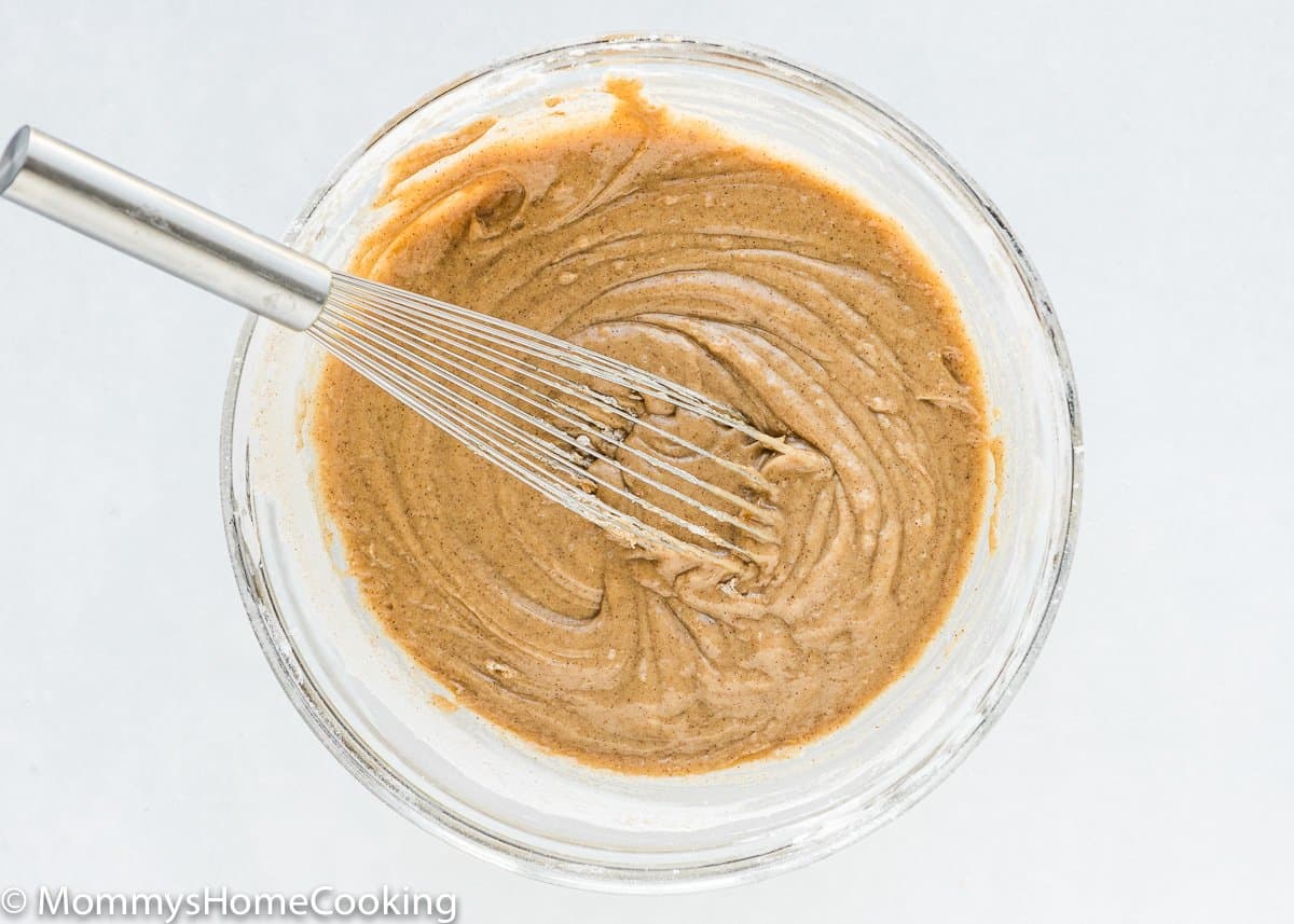 egg-free cake batter in a bowl with a whisk.