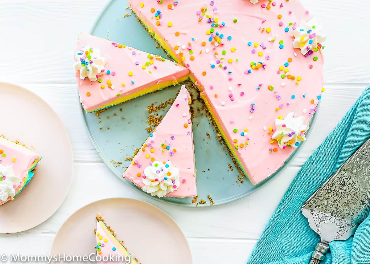 cute no-bake easter cheesecake with two plates on a the side and a cake server.
