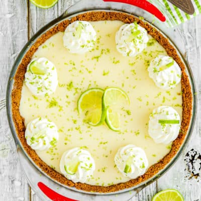 egg-free key lime pie with whipped cream and fresh lime zest on top.