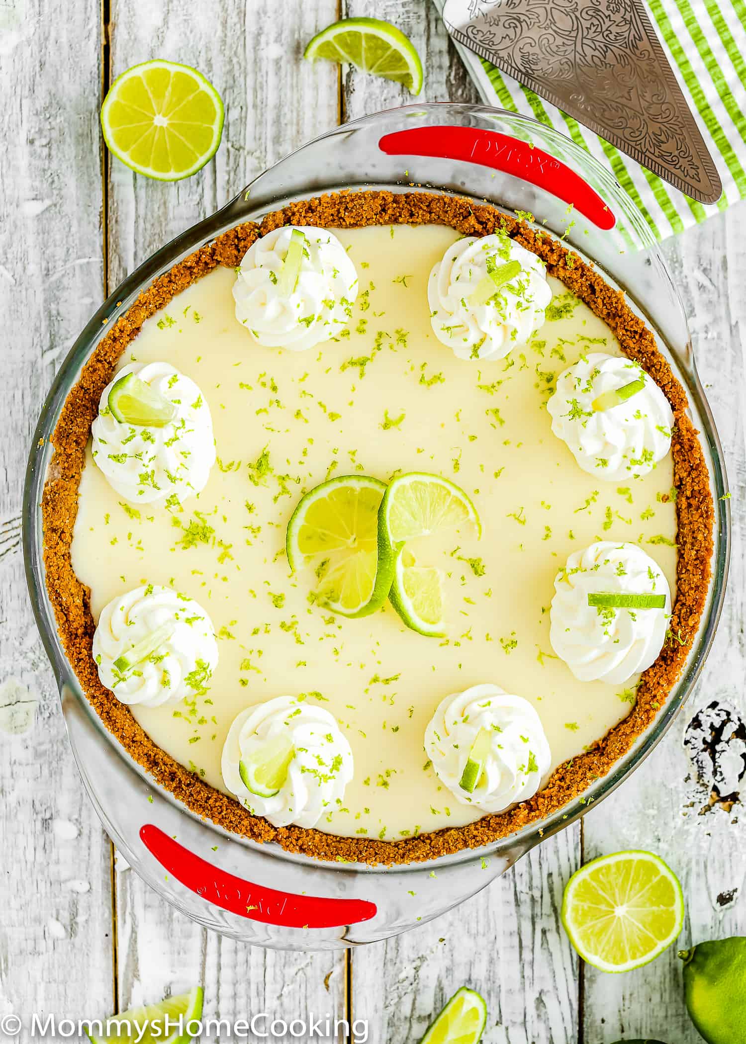 egg-free key lime pie with whipped cream and fresh lime zest on top.