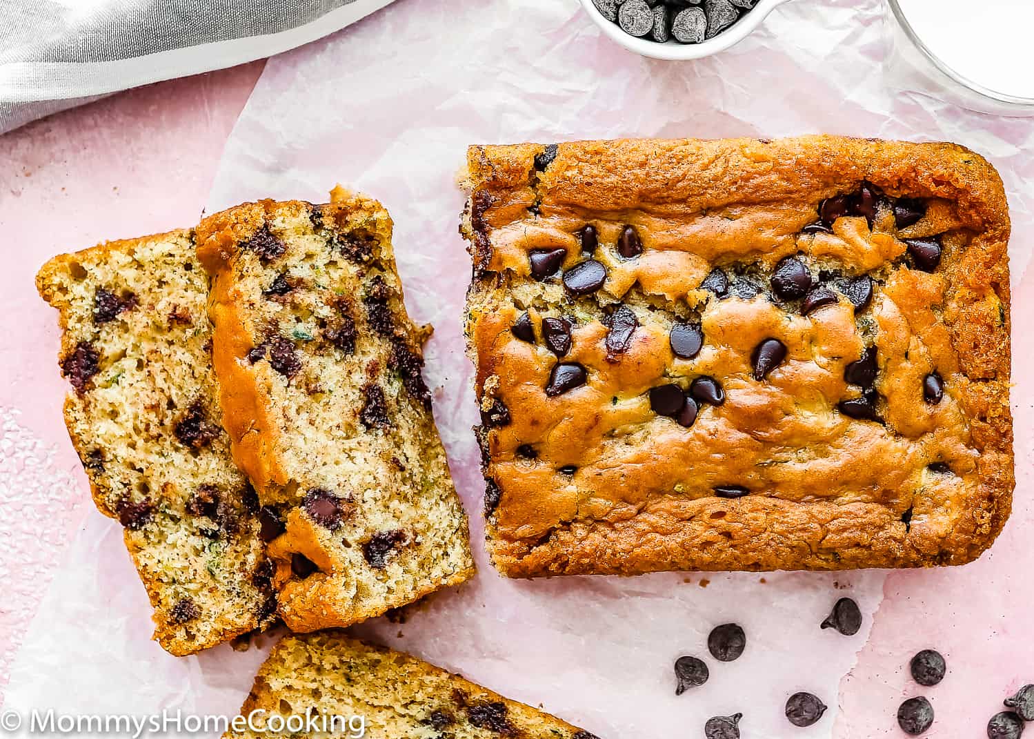 sliced eggless Eggless Zucchini Bread with chocolate chips on top.