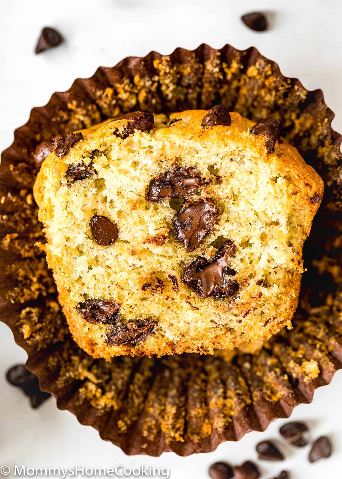 one Eggless Banana Chocolate Chip Muffin showing interior perfect texture.