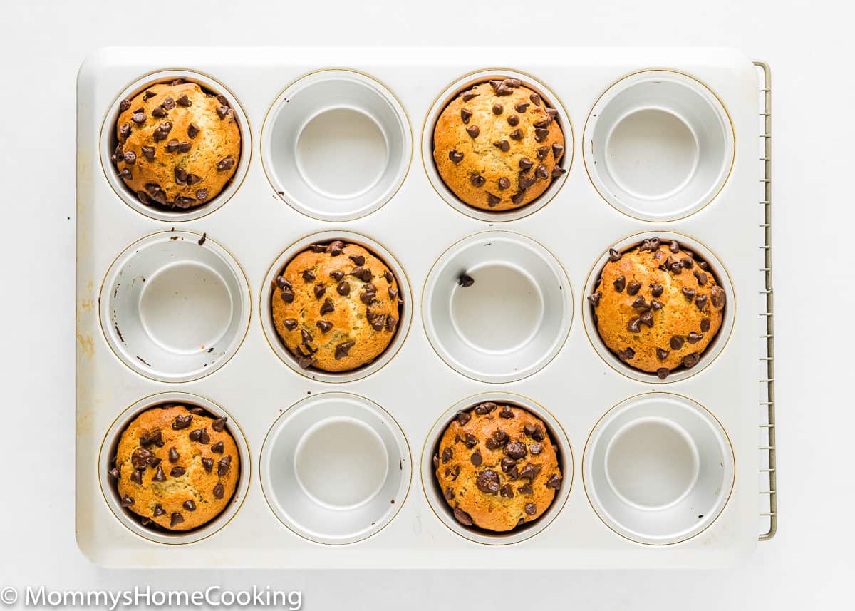 baked Eggless Banana Chocolate Chip Muffins in a muffin tin.