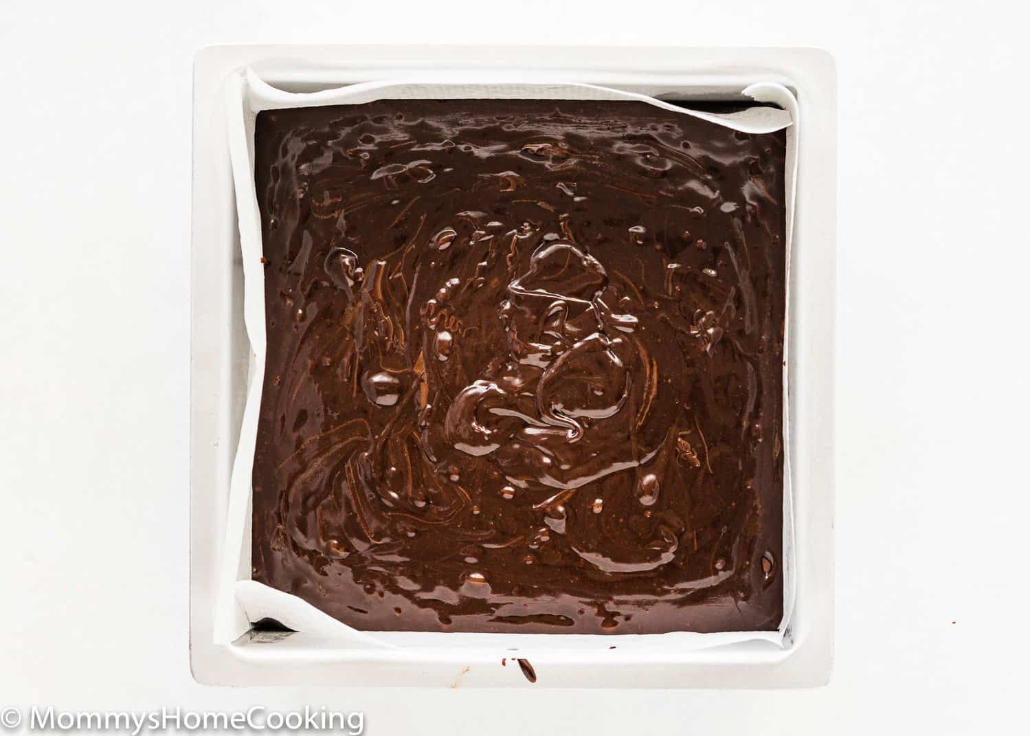 eggless brownie batter in a square baking pan.