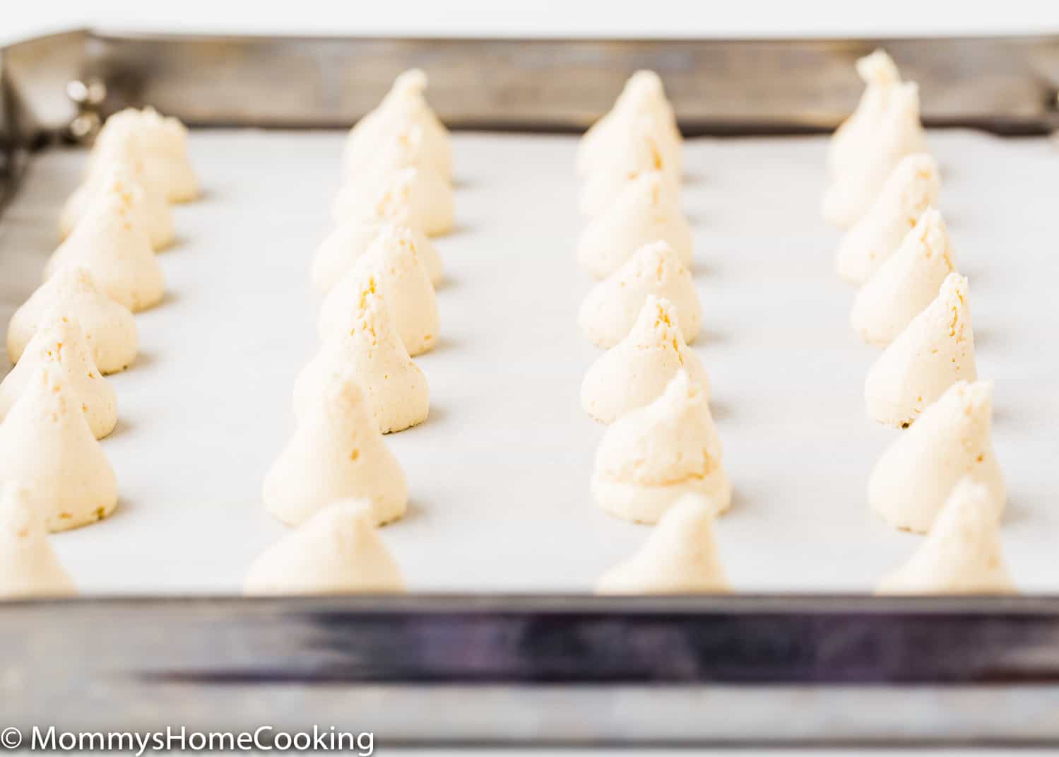 Eggless Vanilla Wafers dough scoop out in a baking tray.
