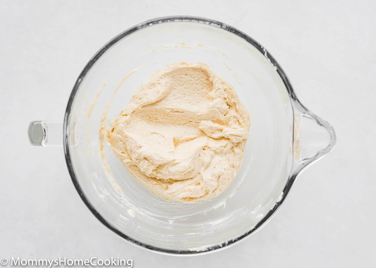 butter, sugar, evaporated milk and vanilla creamed together in a bowl of a stand mixer.