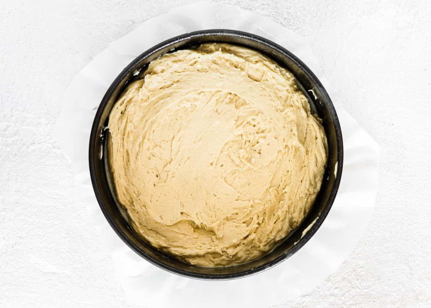 eggless coffee cake batter in a springform pan.