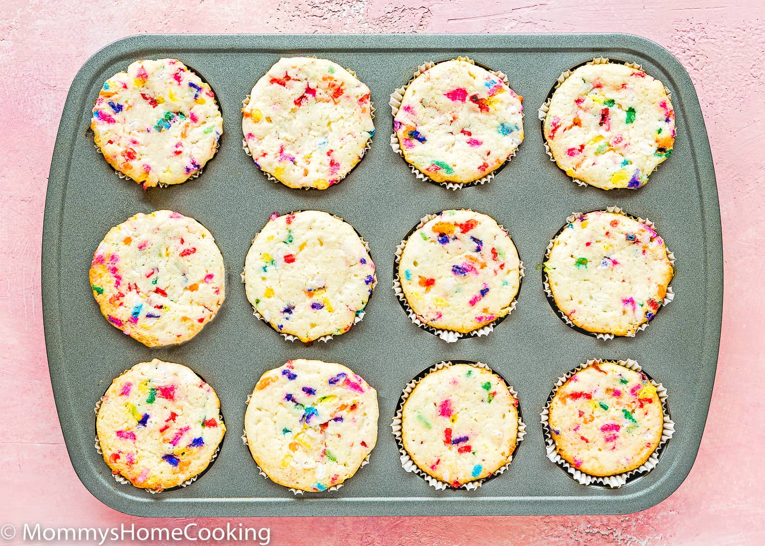 baked Eggless Funfetti Cupcakes in a cupcake pan.