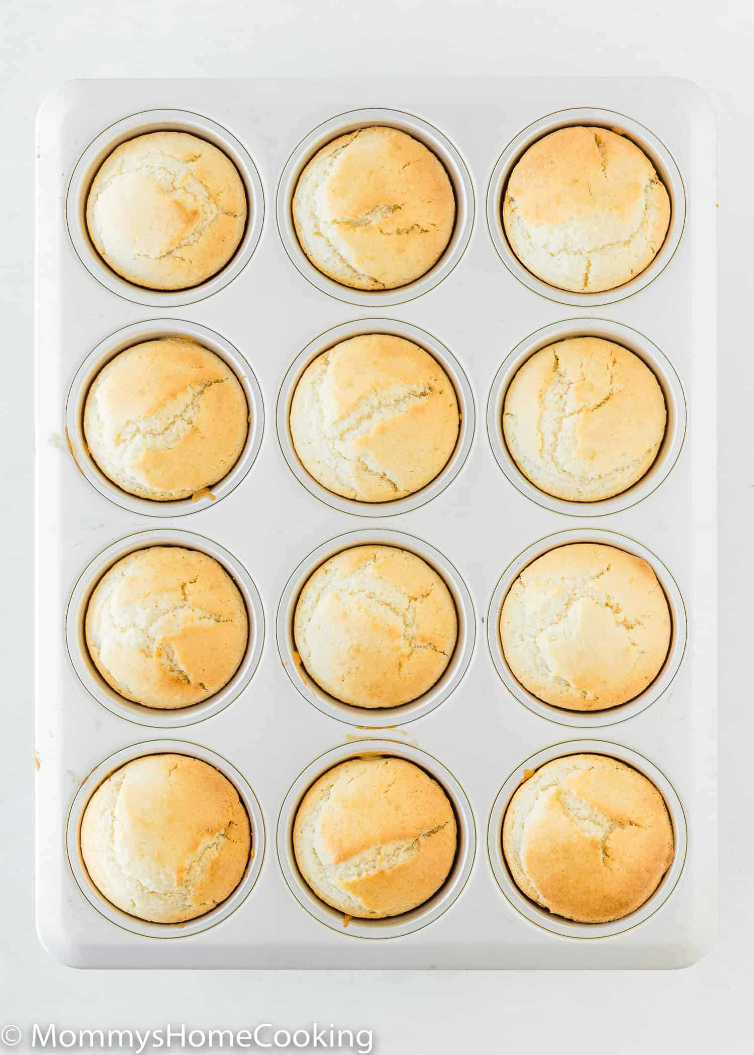 baked Lemon Muffins without eggs  in a muffin tin.