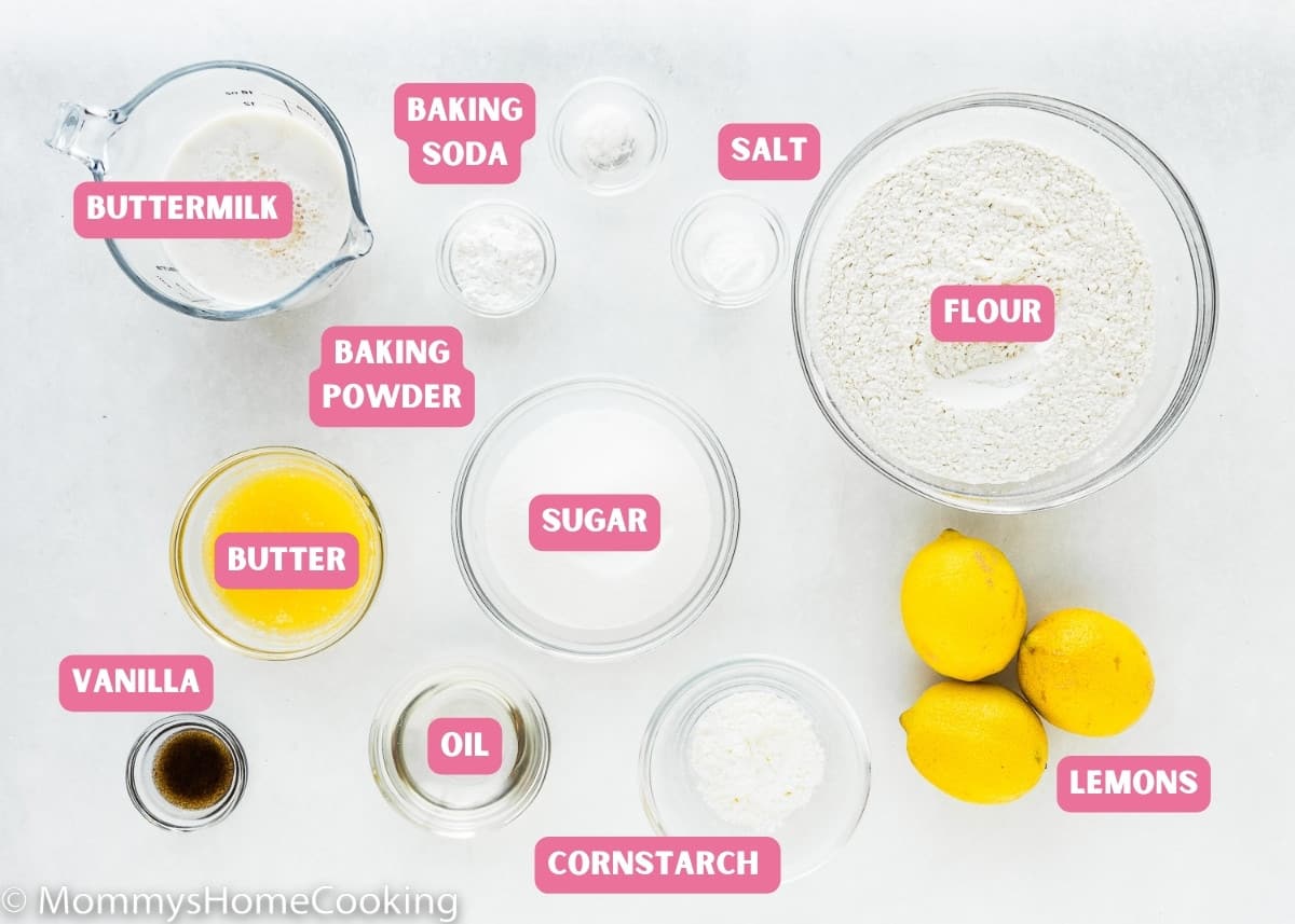 Ingredients needed to make Eggless Lemon Muffins over a white surface with name tags.