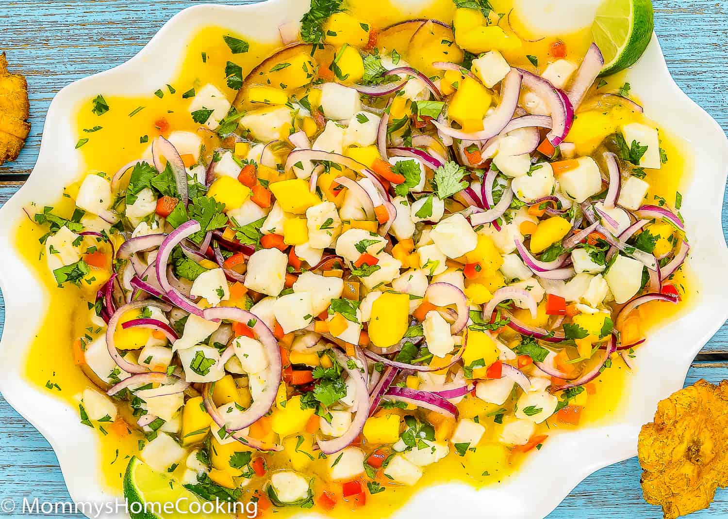 Fish ceviche with mango in a big serving plate.