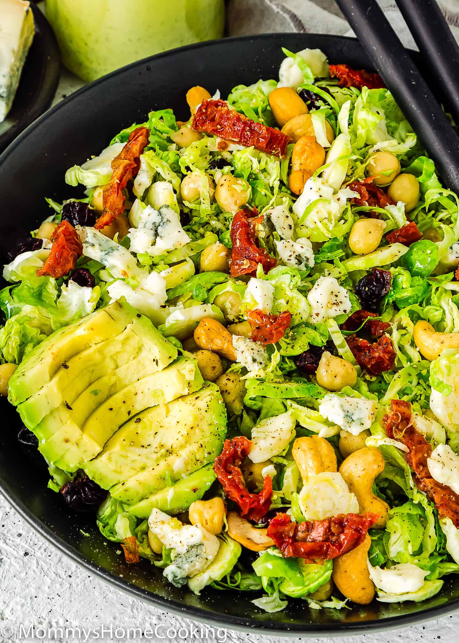 Shaved Brussels Sprout Salad with chickpeas in a salad bowl.